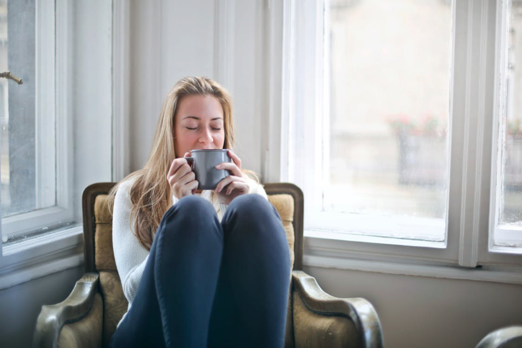 a woman relaxing by the window