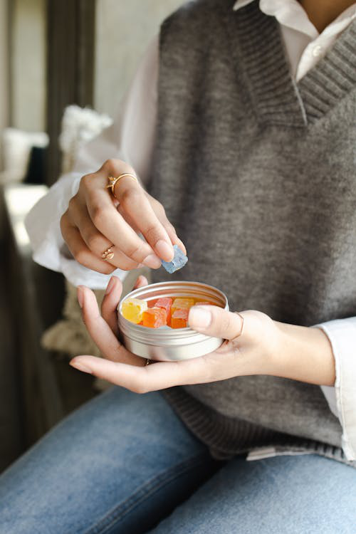 a person holding gummies