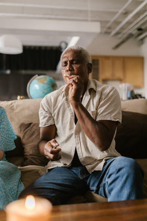 A man smoking a joint