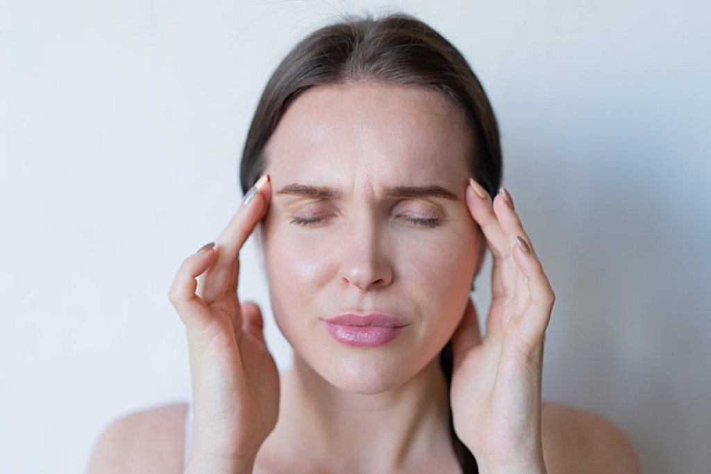 a woman looking stressed.