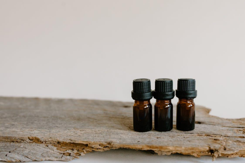 3 CBD oil bottles kept on a wooden surface