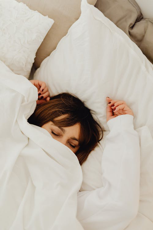 a woman in white sheets. 