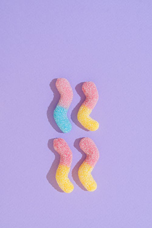 gummies on a lavender surface.