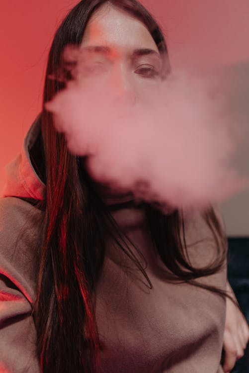 a woman with a cloud of smoke.