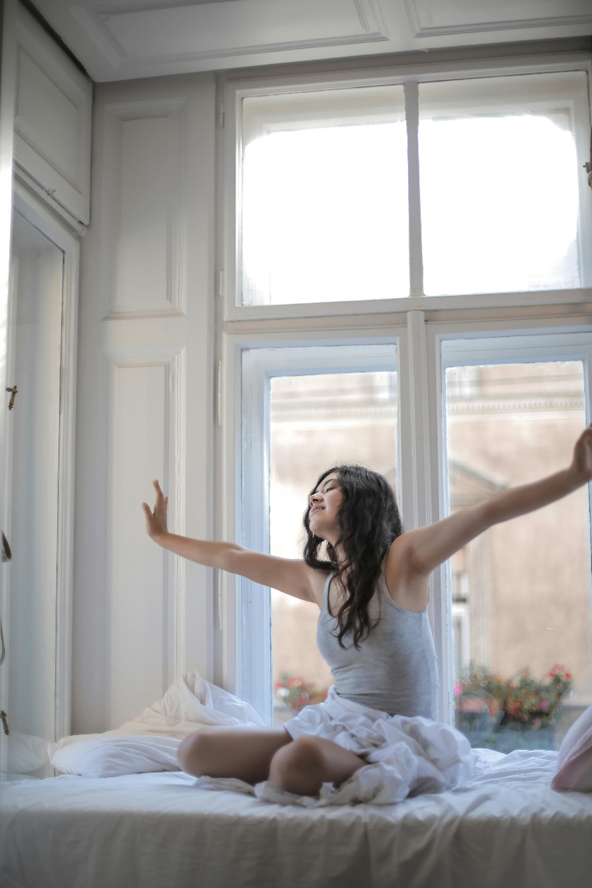 A picture of a person waking up from sleep