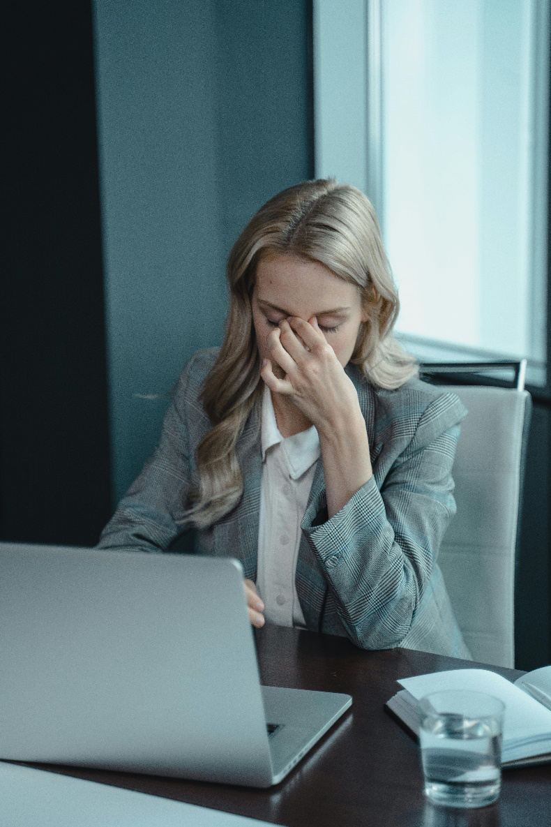 A picture of a person stressed at work