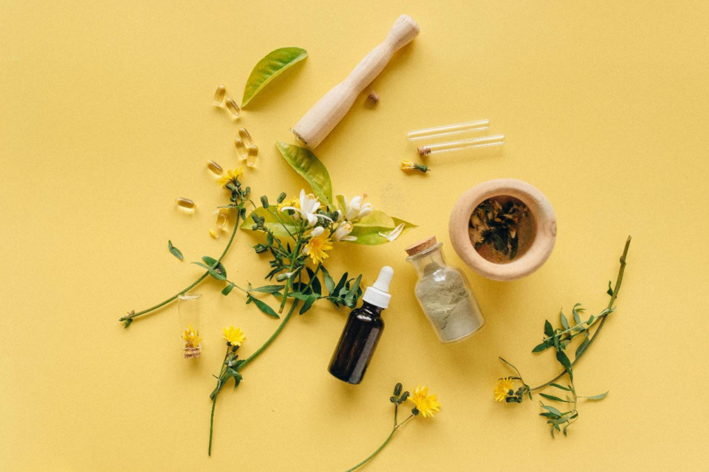 A picture of leaves and containers against a yellow background