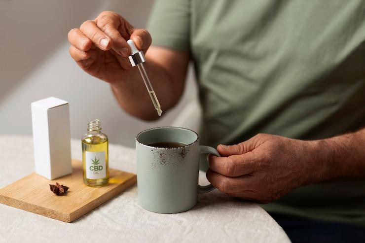 A person preparing for bed with CBD products in their nightstand.