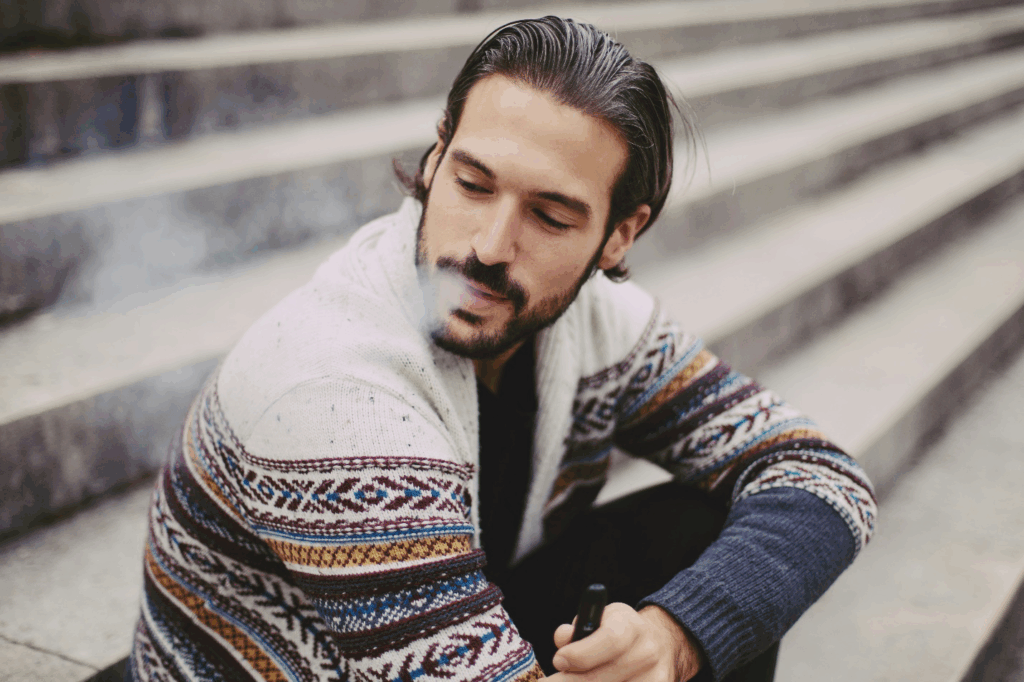 A picture of a person smoking vape
