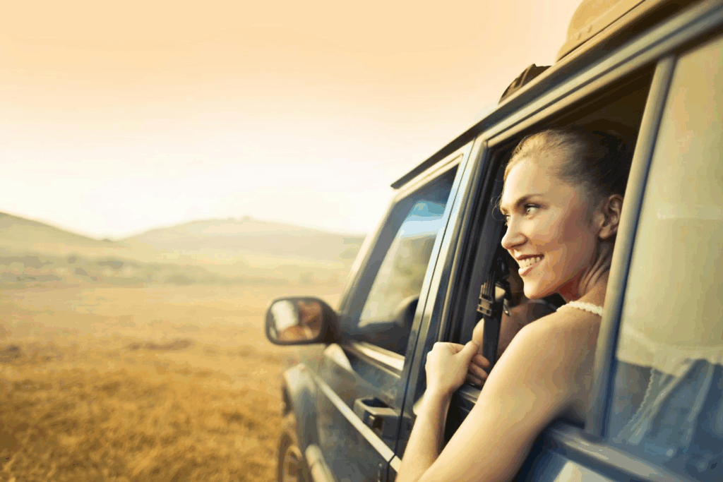 A picture of a person looking outside from a car