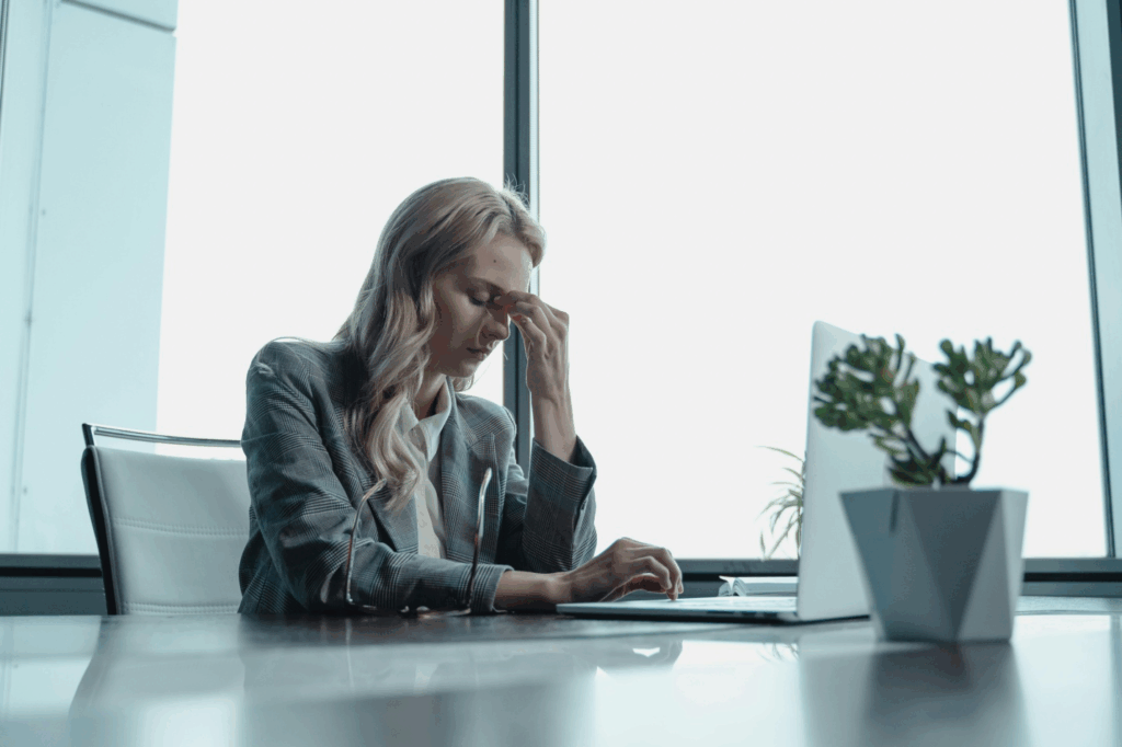 A picture of a person stressed at work