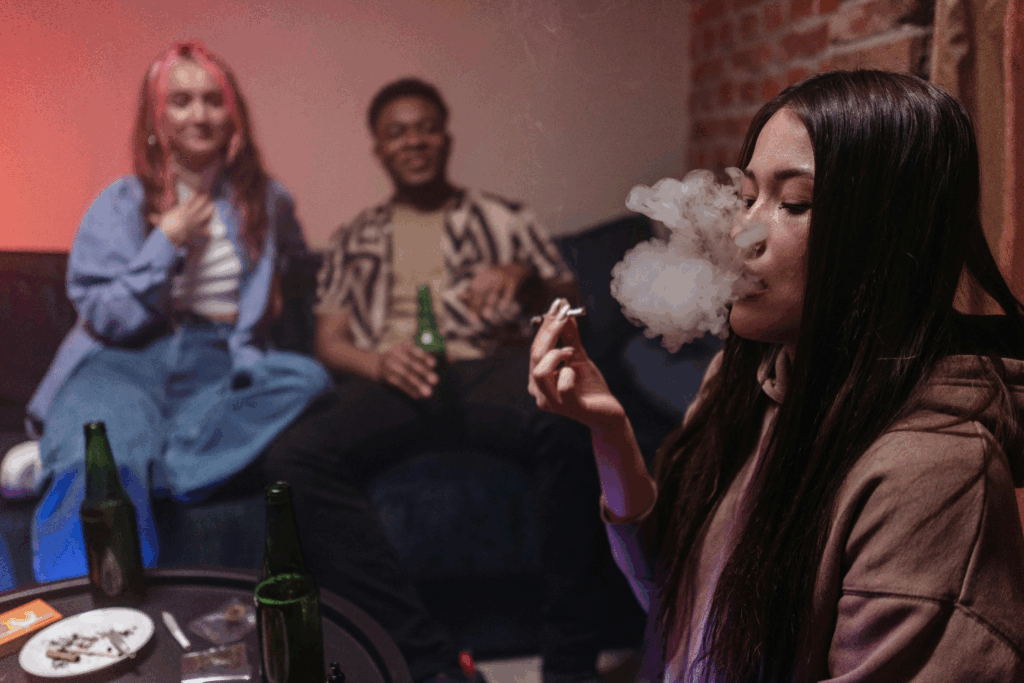 A picture of a person smoking in a party