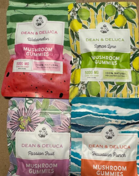 Artistic mushroom gummy packaging in vivid nature-inspired designs and bold flavor labels.