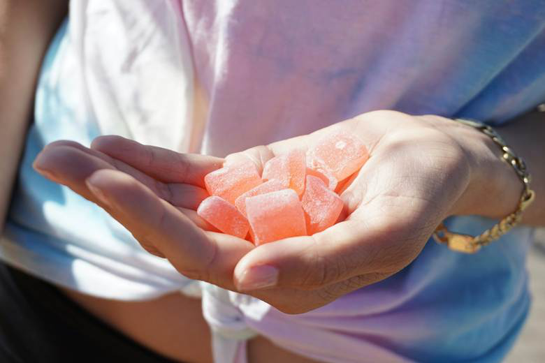 A picture of a person holding gummies
