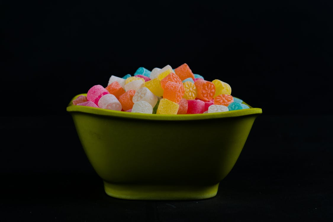 A photo showing a bowl containing various gummies
