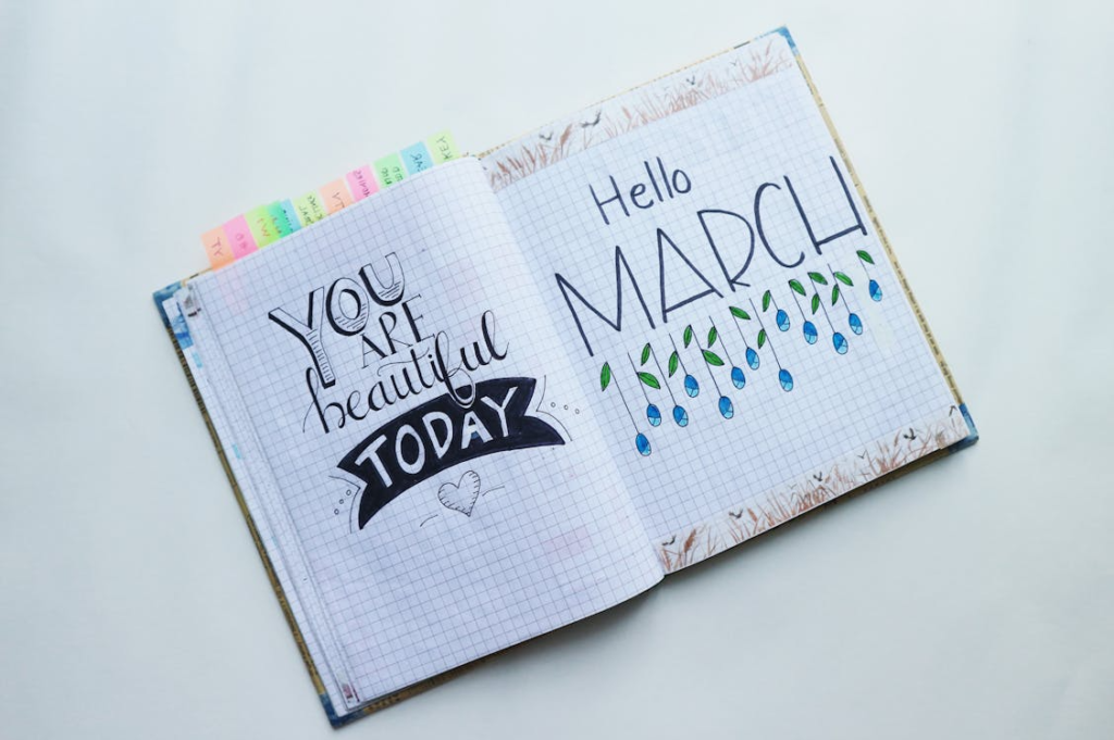 a journal with Hello March and motivational words written on it