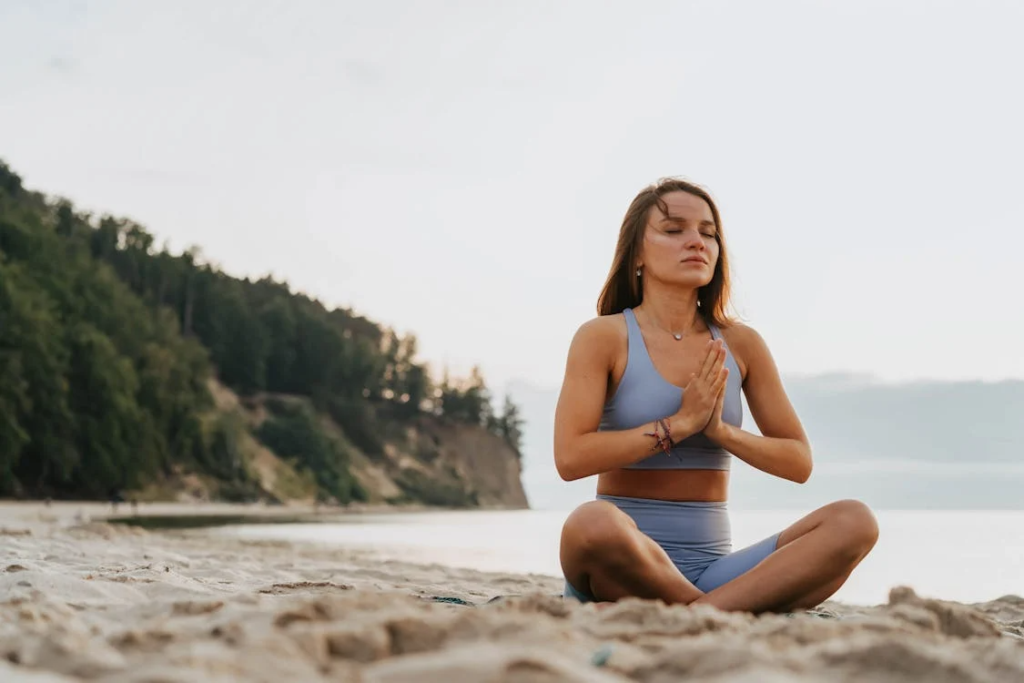 mindful morning routine of a person meditating at the lake
