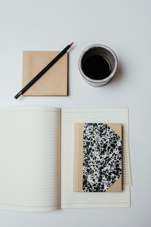 a notebook beside coffee