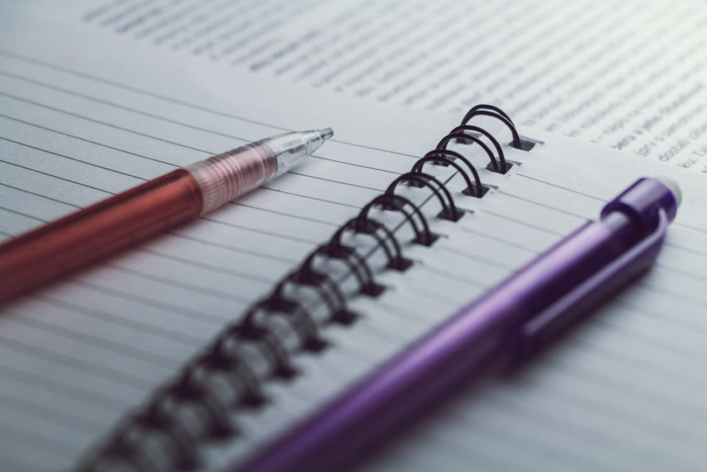  a pen resting on notes