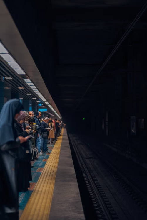 Commuters waiting on train platform