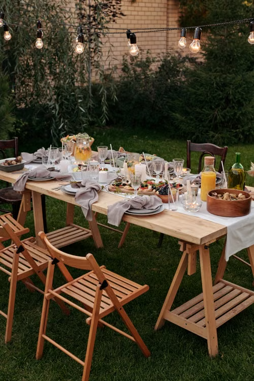 Hosts setting up backyard gathering