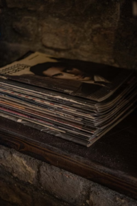 Old magazines stacked on shelf