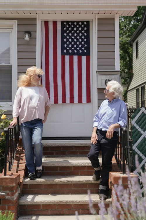 Older adults talking on porch