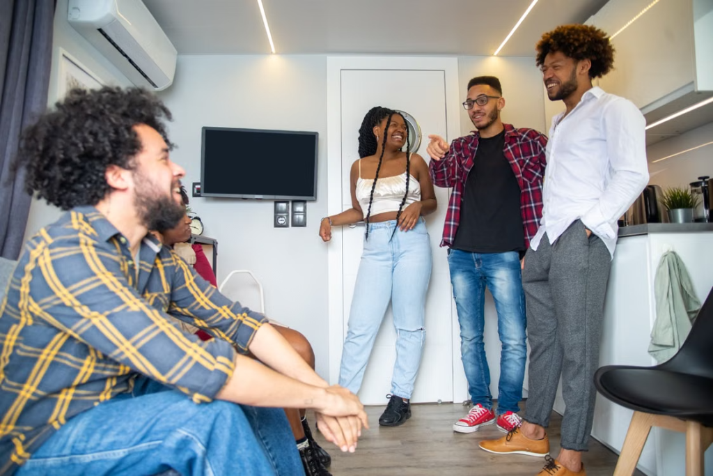 young adults talking in apartment
