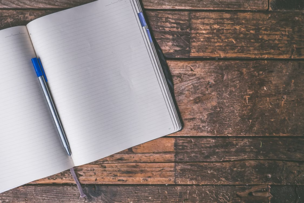 Open notebook on wooden desk