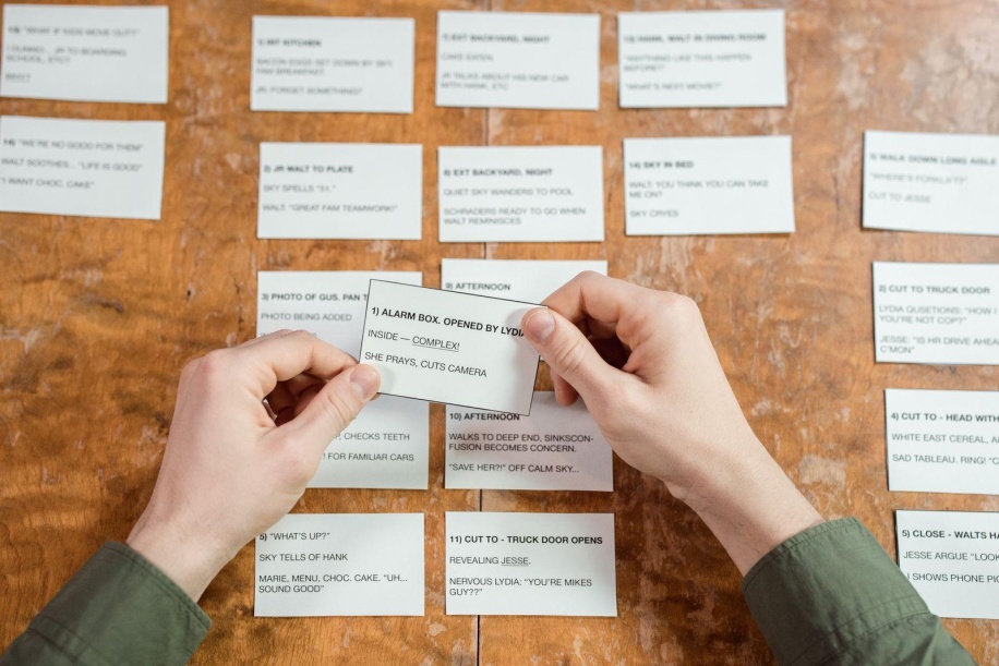 hands organizing index cards