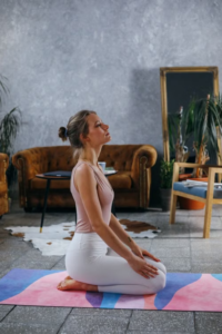 A woman relaxing calmly indoors, winding down in a quiet and comfortable space